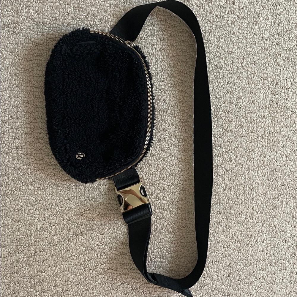 Lululemon Black Fleece Bag with Gold Accents